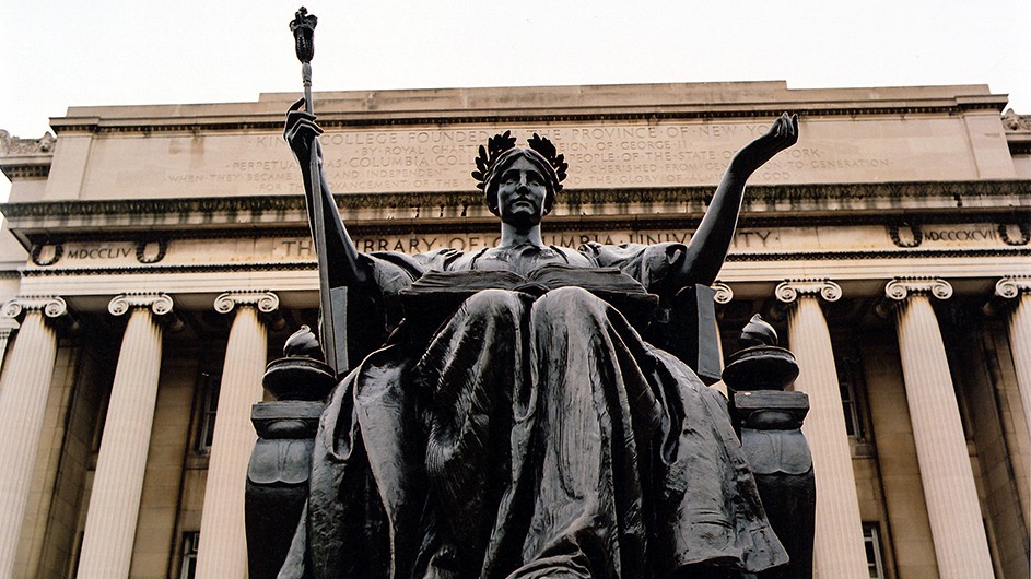 bronze statue of a woman on a throne with a laurel crown and scepter.