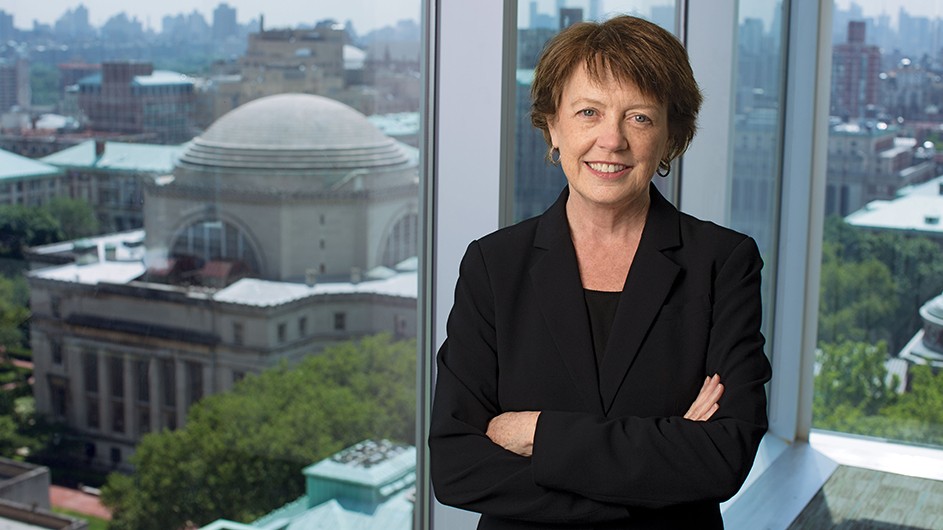 Mary Boyce, a woman with short hair, in a black suit. 