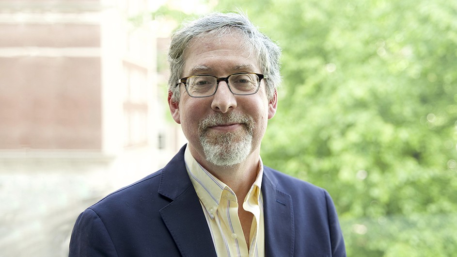 Jeffrey Shaman, a man with short hair and glasses, smiling. 