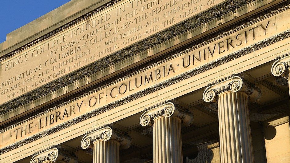 Low Library's facade, a classical building with columns, with the words "the Library of Columbia University" on the facade.