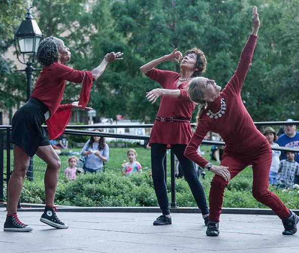 Three women performing modern dance