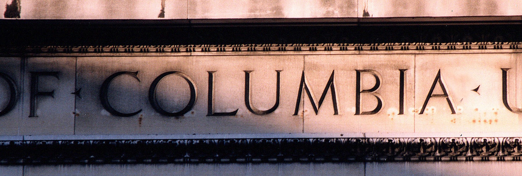 Low Library facade, up close, displaying the word "Columbia."