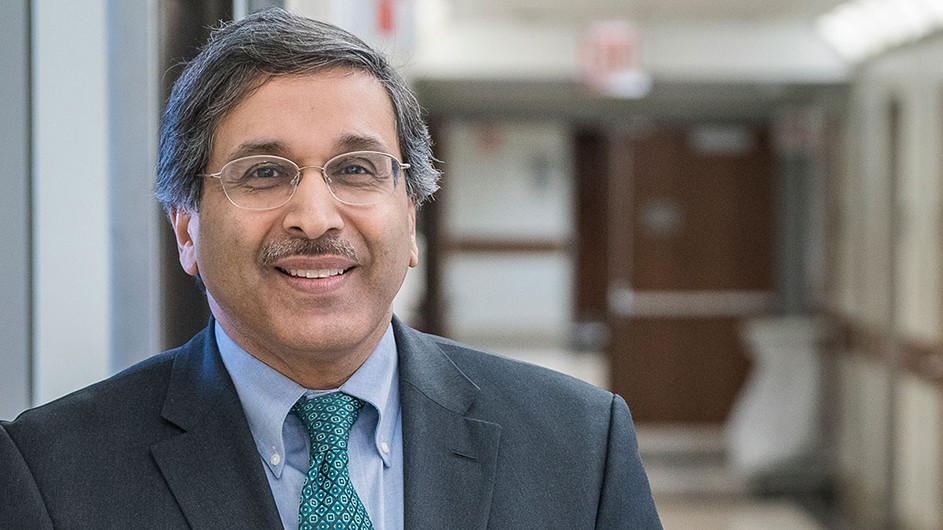 Headshot of Dr. Anil Rustgi, a man with grey and black hair and a mustache.