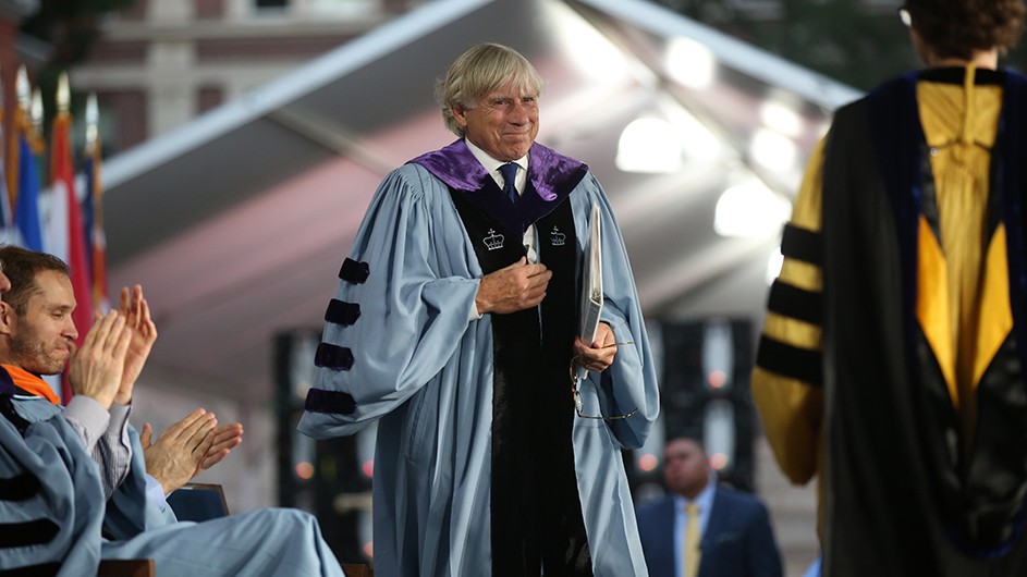 Photo: Bruce Gilbert. President Bollinger, walking up to the podium to deliver his Convocation speech.