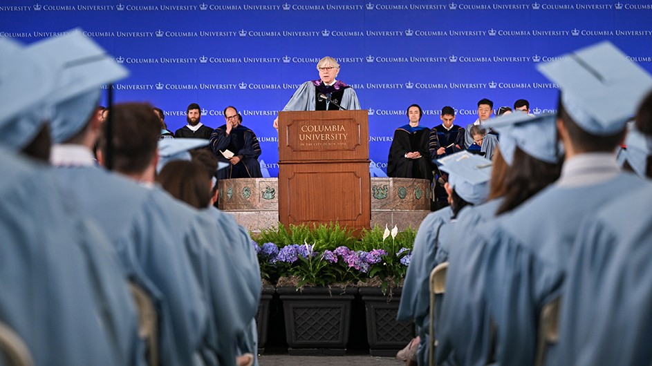 Photo: Diane Bondareff. Lee C. Bollinger, standing at a lectern, speaking.