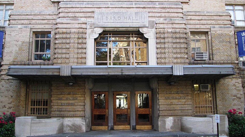 The front of Bard Hall, a stone brick building with a front entrance on a New York City street.