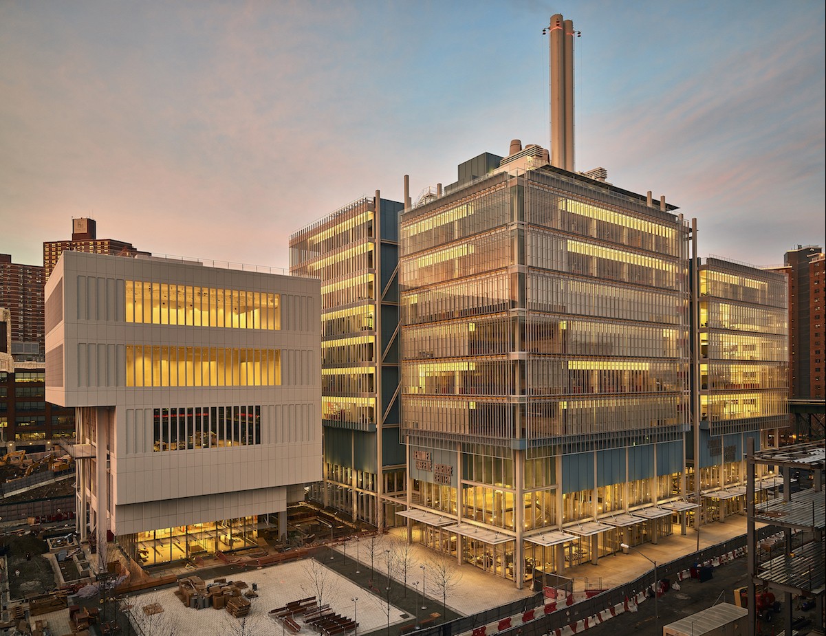 Photo by Frank Oudeman The two new buildings on the Manhattanville campus lit up at dusk