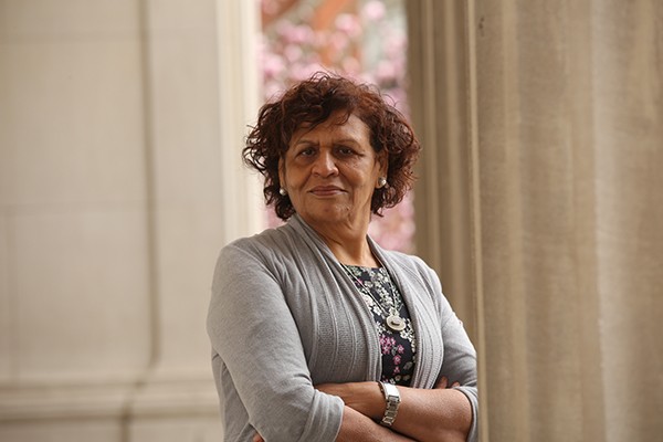 Photo of Professor Nabila El-Bassel, a woman with short dark hair in a gray sweater.