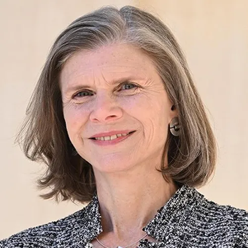 A woman in a black and white top. 