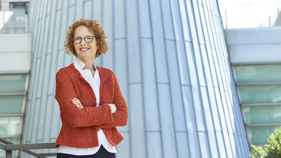 Columbia Law School Dean Gillian Lester. standing outside the Law School, smiling