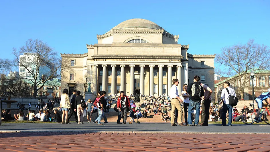 Students walking to class in front of Low Library