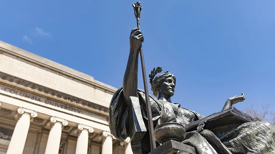 Bronze statue of Alma Mater, a seated women in a classical robe, with a laurel in her hair and a scepter in her hand. 