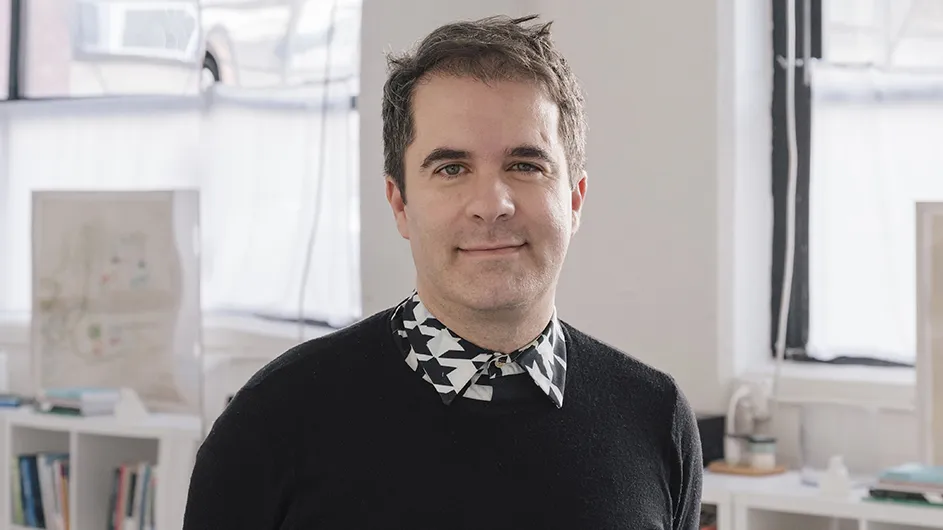 Andrés Jaque, a man with short brown hair wearing a brown sweater