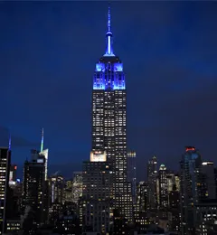Photo of the Empire State Building glowing blue in honor of President Beilock's inauguration