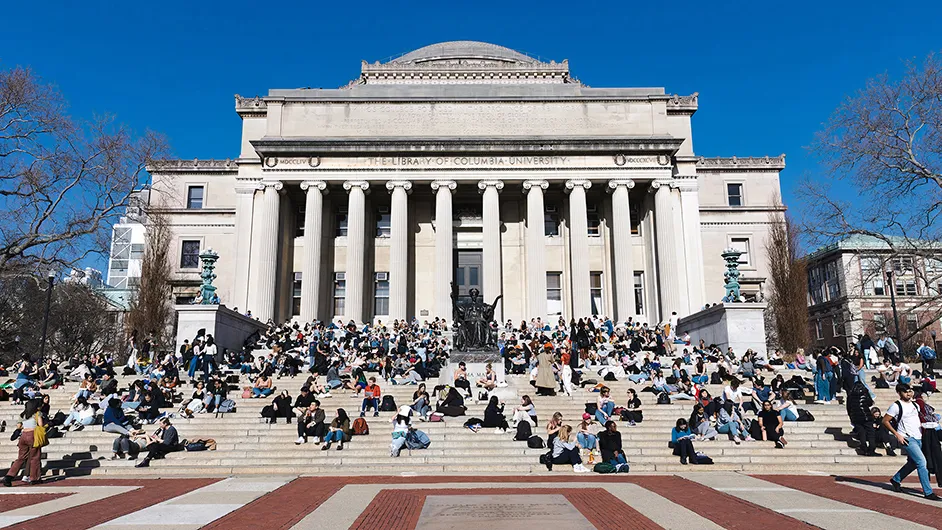 A view of the front of Low Library, full of people. 