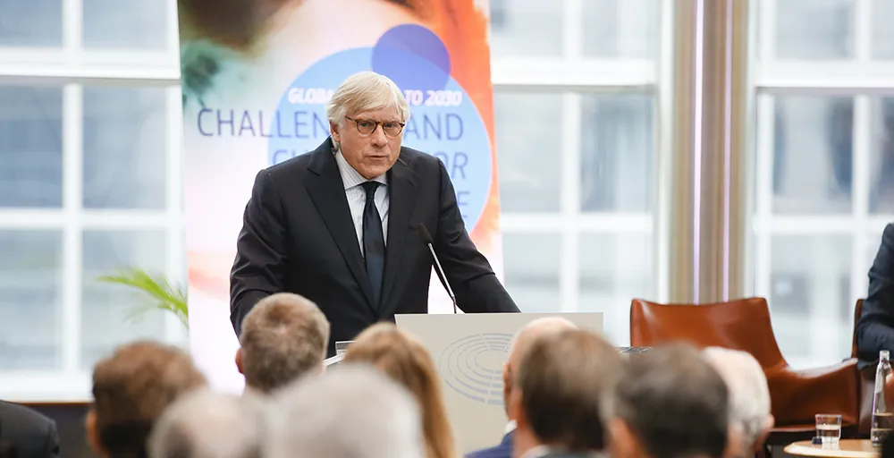 Photo of President Bollinger speaking at a podium at the annual ESPAS Annual Conference 2019