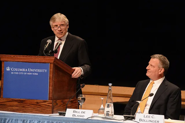 At the podium, Lee Bollinger introduces Mayor-elect Bill De Blasio at the NYC Children's Summit 