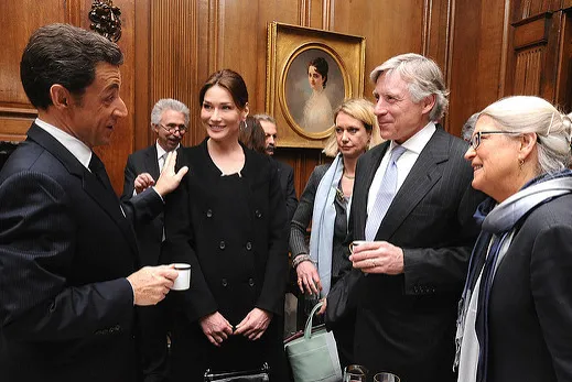 Nicolas Sarkozy (left) touches the shoulder of wife Carla Bruni as they converse with President Lee Bollinger and Jean Magnano Bollinger