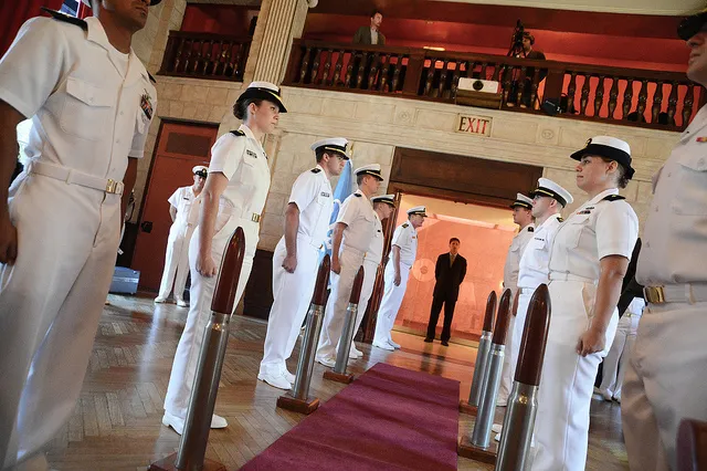 ROTC Members in white uniforms lined up indoors at Columbia University
