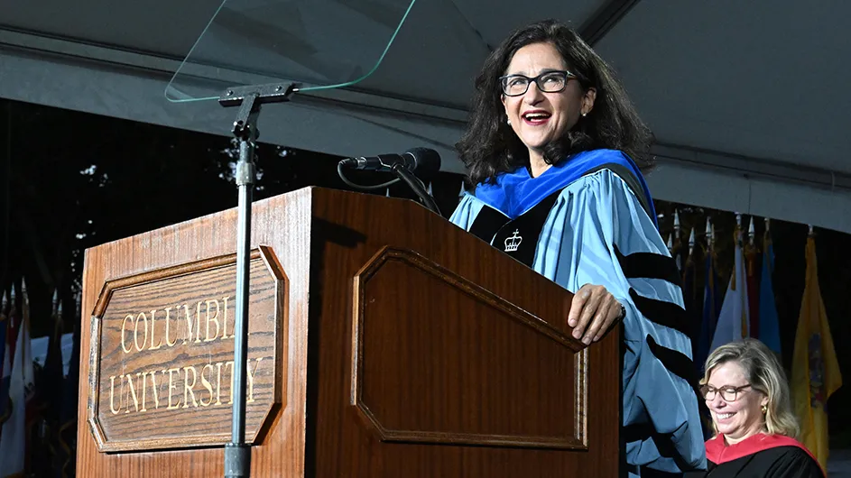 President Shafik delivers the Convocation address from a podium under a tent in front of Low Library. 