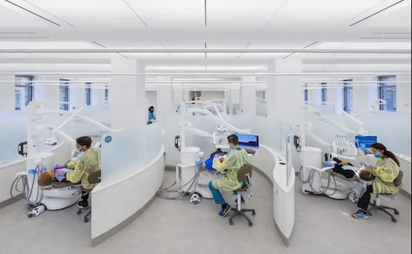 Dental students at work in the new precision dentistry clinic. 