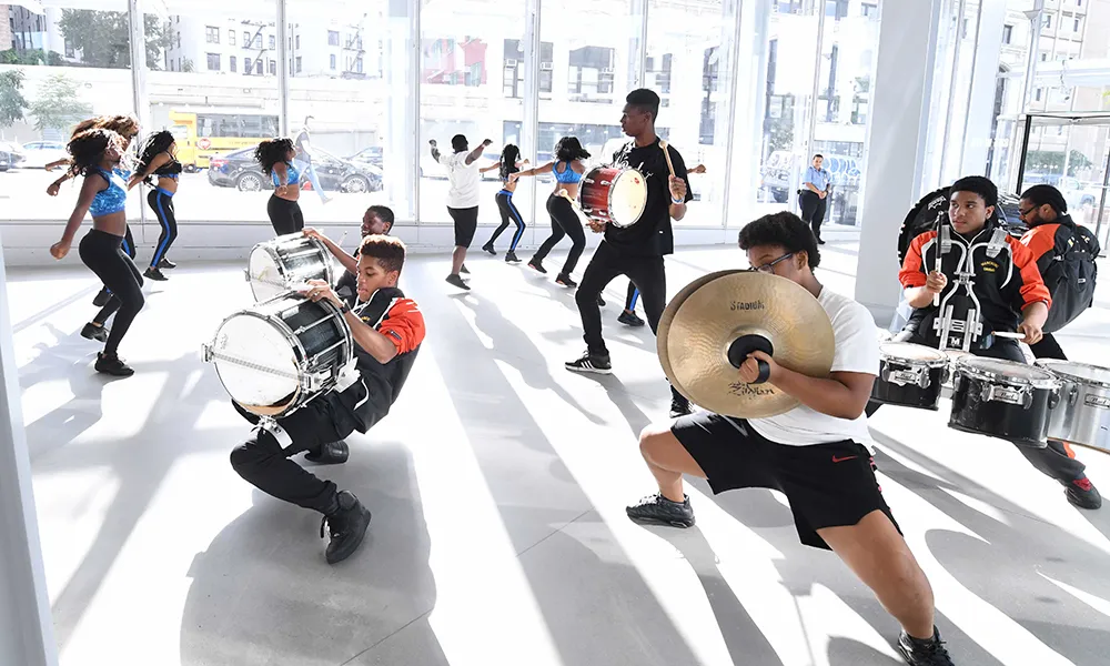 Photo of the Marching Cobras performing at the Forum opening